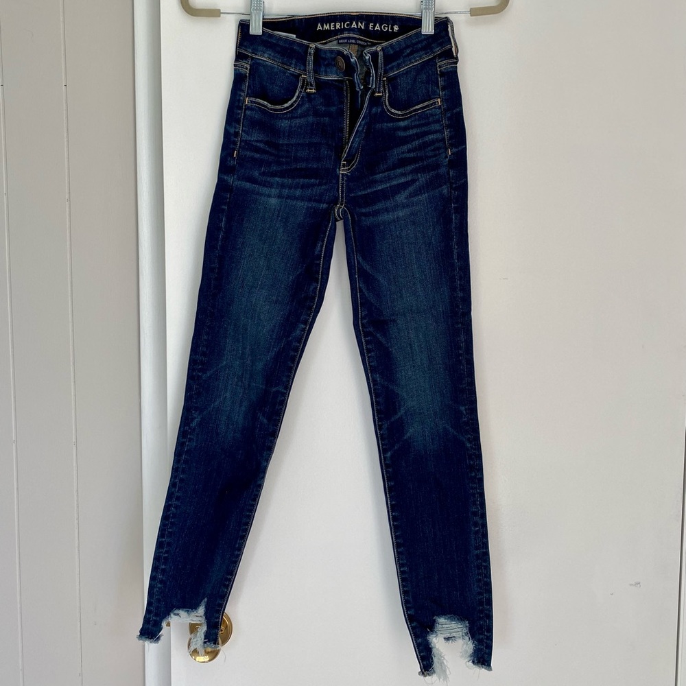 Cropped skinny jeans with distressed bottoms